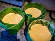 Leaf-wrapped moulds filled with nian gao batter. Leaf-wrapped moulds filled with nian gao batter.