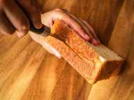 Cut slits into the edges of each bread slice to create a tunnel. Cut slits into the edges of each bread slice to create a tunnel.
