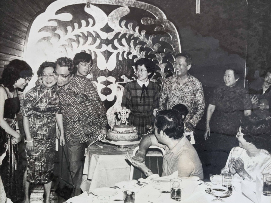 Emma's family at one of many parties. Her grandma, second from right, and mum in the centre looking at her with a trademark blend of apprehension and affection.