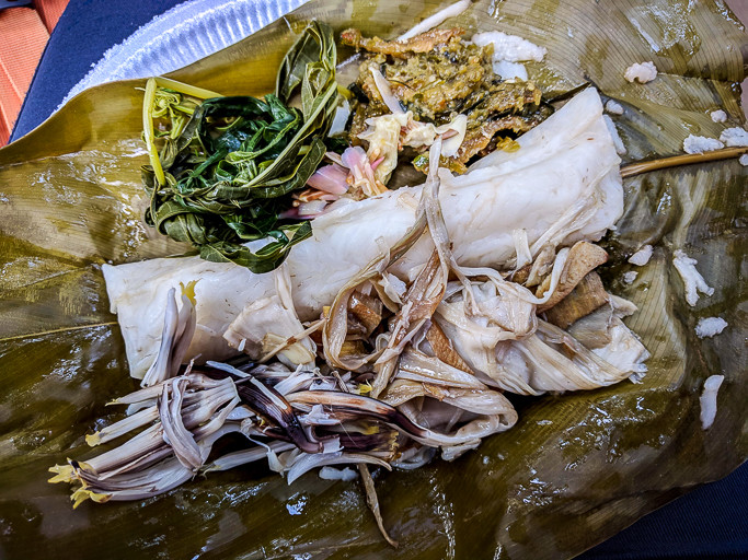 A veritable feast served to visitors: Nibung hearts, banana flowers, fermented durian sambal, cassava shoots, with rice wrapped in bemban leaves cooked in bamboo. Photo: Alia Ali