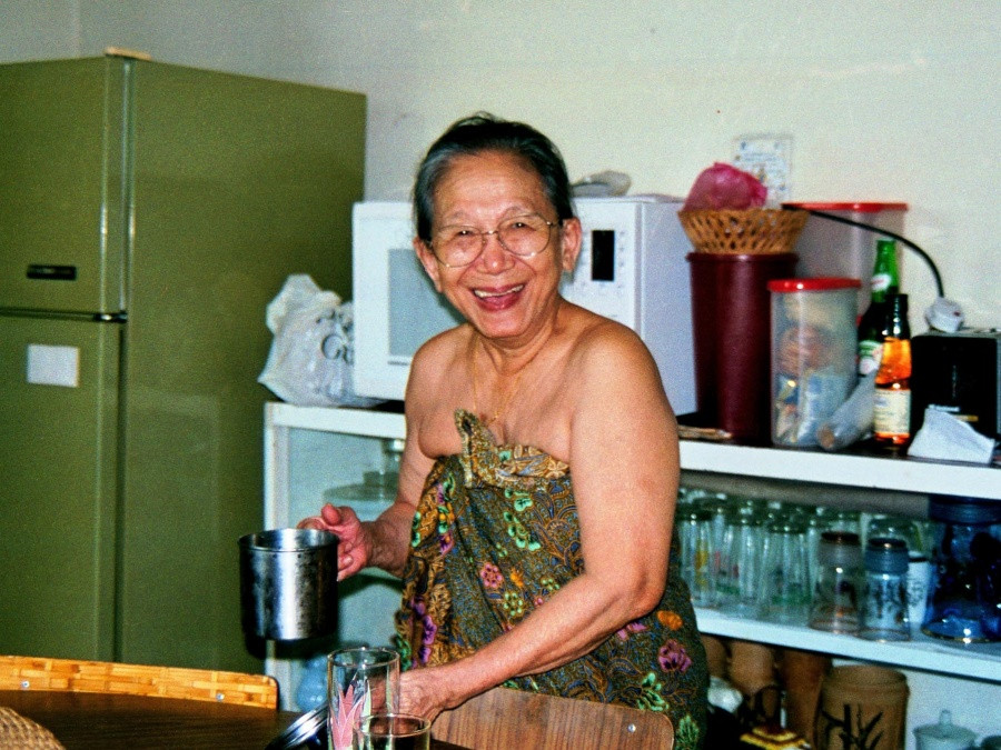 Zara's grandmother in her home kitchen.