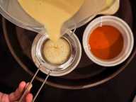 Pouring the custard into the mould Pouring the custard into the mould