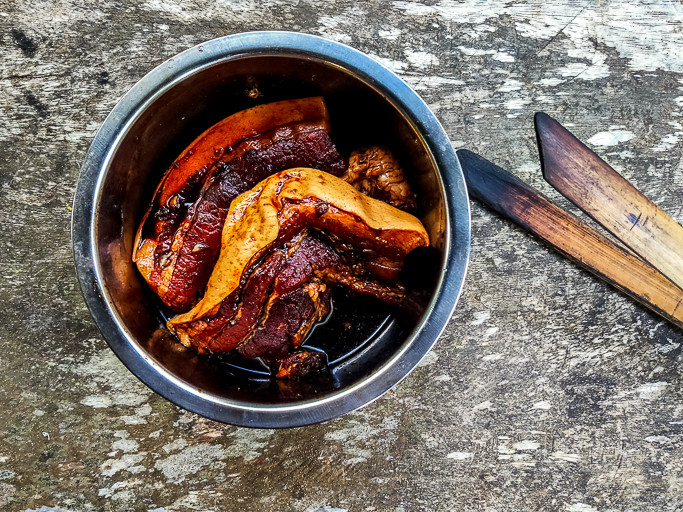 Pork belly is marinated in soy sauce and spices for a few hours before going on the grill. Photo: Maynard Keyne Langet